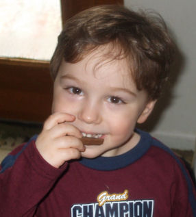 Will eating chocolate - my boy eating his favorite snack..chocolate..just like his mama :)