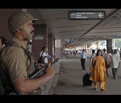 Beauty - ON GUARD: A CISF personnel guards the airport in Hyderabad after the warning of a terror attack by Al-Qaida militants. (Reuters)