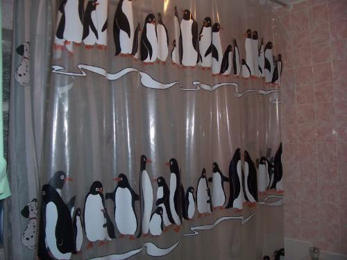 Shower Curtain - Shower curtain with penguins on it