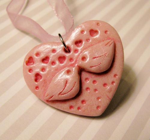 Lovey Doves Heart Necklace pendant - Made with polymer clay and painted a bright pink. This pendant hangs on an 18" sterling plated chain and makes a great Valentine's Day gift or a nice piece of wearable art for anyone who loves doves, hearts or the color pink! Lovey Doves Heart Necklace pendant - Made with polymer clay and painted a bright pink. This pendant hangs on an 18" sterling plated chain and makes a great Valentine's Day gift or a nice piece of wearable art for anyone who loves doves, hearts or the color pink!