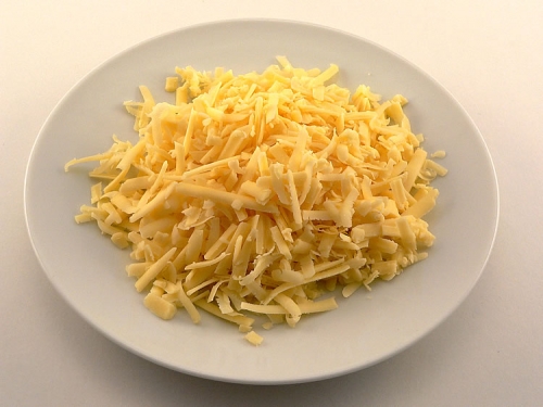 Cheddar cheese - Plate of cheddar cheese.