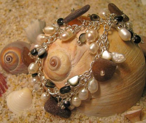 Gift from the Sea bracelet - Polished shell chips, fresh-water pearls and brown beach glass adorn this 7 1/2' bracelet. Available at my Etsy shop