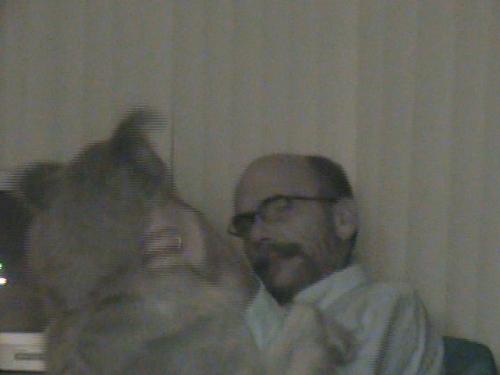 A close up - A close up (zoom lense) of my husband and the dog.