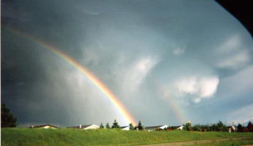 double rainbow tornado - I took this photo a few years ago of a tornado with a double rainbow in front of it.