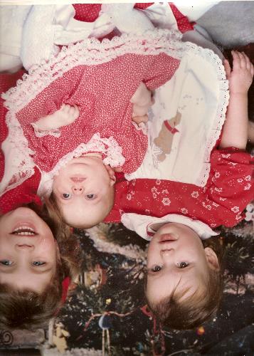 me and my sisters - arent we all so cote? lol im the one in the middle ..i didnt hardly have hair lol