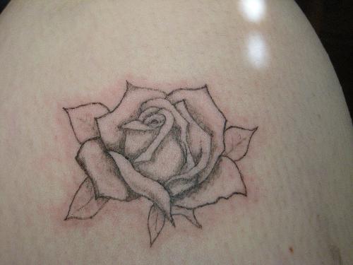 rose - this was my first ever tattoo i did.. i did it on myself... its on my leg, but its upside down if im standing LOL doesnt matter because no one will see it.. i wear pants year round lol