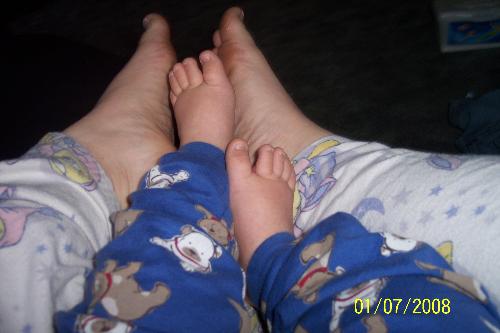 our feet - mommy and baby feet in pajama pants