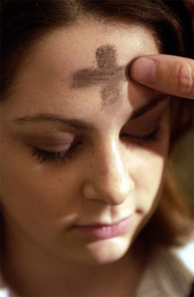 Ash Wednesday - A young girl receiving ashes on Ash Wednesday
