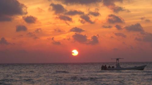 Sunset Isla Mujeres - From Cancun, the sunset is not visible. Must view from Isla Mujeres or Cozumel. Typical gorgeous happy hour sunset.