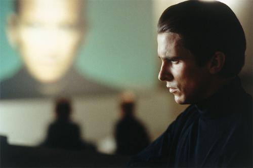 Christian Bale - Christian Bale profile with big brother esq monitor in the background film still from equilibrium
