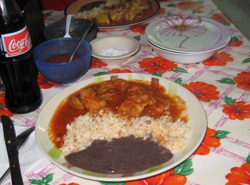 Authentic Mexican Food - No menus, no problem. After checking out what was available in the kitchen, I chose pork in a chili sauce. Small, local joint on the main dragin Tulum, Mexico.