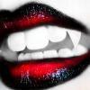 Lips with Vampire fangs - A picture of Red Lips with Vampire fangs