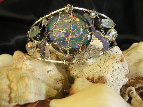 Jewelry Designing - Completely hand-made bracelet, made with fine silver wire, 14k gold wire, amethysts, aquamarine, tanzanite, swarovski crystals, and a large glass dicroic glass center piece.