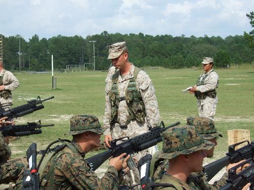 What I do now - This is me in front of some students teaching them about the M-203 Grenade launcher. 