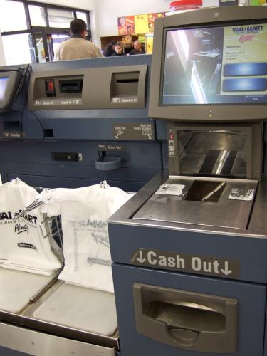 Self check out - Self check out station. Walmart