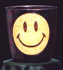 Be Happy - Have a nice day! Happy Face - Smiley Guy makes you feel cheerful just to look at him. Translucent sparkle yellow face against a black iridescent background.