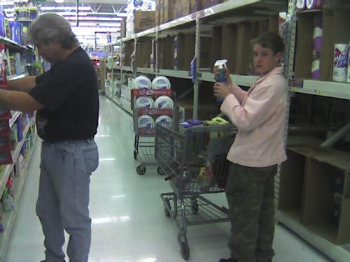 Shopping at Walmart! - My silly son in my pink jacket and my man getting some cleaning necessities at Walmart! My son offered to switch jackets, I was cold and his was suede. Oh what a gentleman, chivalry is not dead!