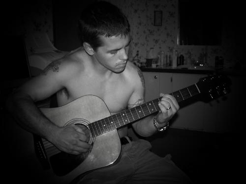 my husband playing me a song! - tihs is my husband playing his guitar for me! i love to hear him play!