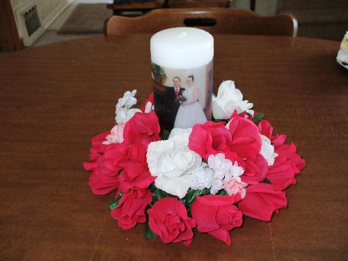 wedding candle - picture of happy couple on candle with floral ring