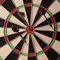 Darts and Dartboard - Darts in a dartboard.