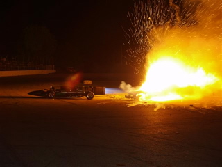Green Mamba Jet Car Action Shot - The Green Mamba Jet Car does a burn of a car during it's show each year. This is a shot of the jet engine burning a junk car behimnd it. Awesome show. It stops traffic on the highway right by the race track