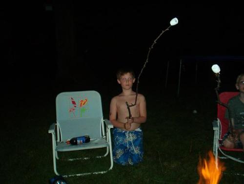 Nick marshwallow roasting - My son, Nick roasting marshmallows in the backyard. Both of my kids love to roast marshmallows. The family loves to make a fire in the backyard and just hang out.