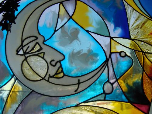 Stained glass moon symbol - This was a gift from a friend and hangs in my office window
