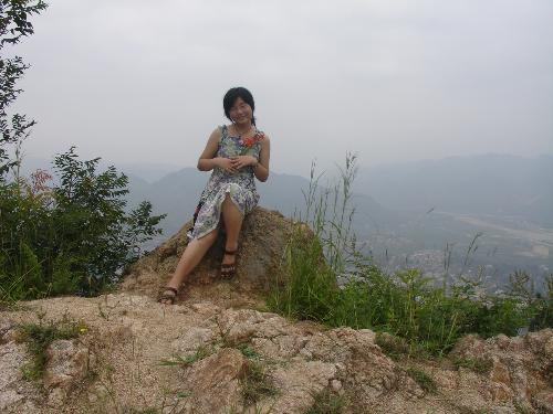 I'm on Fengguan mountain -  This is a picture in my hometown.A small county of China.And I'm on the Fengguan mountain . This picture is taken in the summer vacation.Though my hometown is very small and a litle poor I think it is very beautiful.