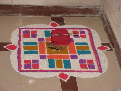 Rangoli - This is India's tradition. Its called Rangoli. It put at the doorway. Its a decoration that is done in front of the house.