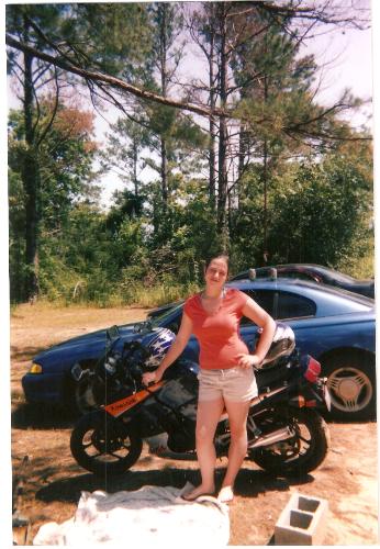 me beside my husbands motorcycle! - this is been awhile back about 2 yrs! but i like this picture!