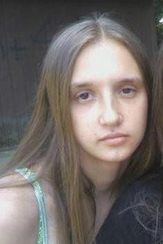 Me - This is a picture of me at the park with my sisters. (I cut them out)