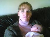 Me and my baby girl - This was taken around Christmas time of me and my daughter. At the time she's about 2 months, now she is 4 months.
