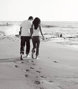 Couple  - Photo of couple walking on beach arm in arm