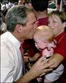 Politicians love babies! - bush and baby Politicians love babies! - bush and baby