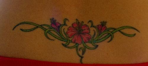 My Flower Tattoo - Here is an image of the tattoo on the small of my back. It isn&#039;t the greatest photo because I am home alone and had to take it myself!
I got this one when I was 24 years old.