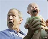 Pres Bush - holding a crying baby
