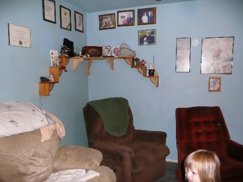 part of our front room - one corner of our front room you can see some of the pics we have up