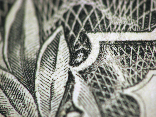 spider on the dollar bill - Picture of the spider on the upper right hand side of a dollar bill..I didn't know this until now when my daughter told me..