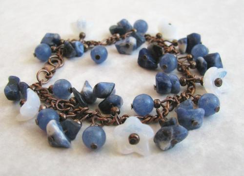 Copper Blues Bracelet - This 7 1/2' antiqued copper bracelet is adorned with sodalite chips, blue aventurine, and white opalescent flower cup beads.  The pretty white flowers really enhance the white/gray veining in the sodalite! A wonderful bracelet for spring~ will look great with denim too!  AVAILABLE at my shop at ETSY.com