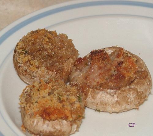 Appetizer Stuffed Mushrooms - I made these to go with lunch today. They were so pretty, I had to snap a photo.   Mushrooms can be stuffed with all types of yummy fillings. This particular time, I used bread crumbs, seasoned with garlic, oregano, basil and a dash of paprika, olive oil and melted, shredded cheddar.   On other occasions, I'd mix cream cheese, herbs and butter cracker crumbs. That makes a good filling as well.