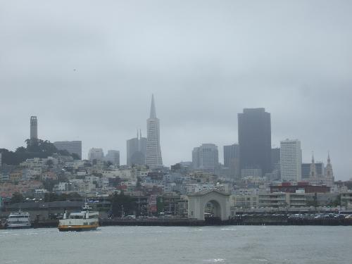 San Francisco - view from the bay - This is a picture of the San Francisco shoreline taken from the bay. We were on a ferry boat in the spring of 2007. This picture has many building in it that are famous landmarks in San Francisco, including the Transamerica Pyramid (pointy-topped one in middle of photo - 853 ft. high) & the Coit Tower on Telegraph Hill (smaller cylindrical building to the left side) which is 210 foot high!