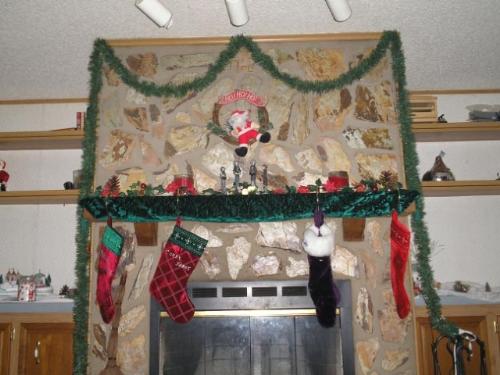 Our fireplace at christmas 05 - Still settling in our new home. so much to decorate and not enough stuff to do it with. How funny.
