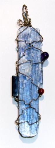 Kyanite Pendant - Here is a Kyanite gemstone in a silver wire wrap with various other semi precious stones incorproated into the pendant.