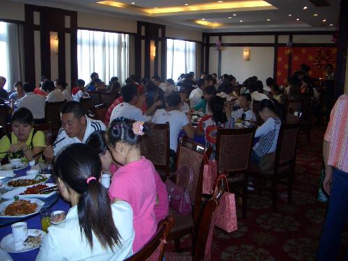 wedding dinner - This is the wedding dinner at one of my colleague's. Everyone sits around one table for dinner, each table with ten people.