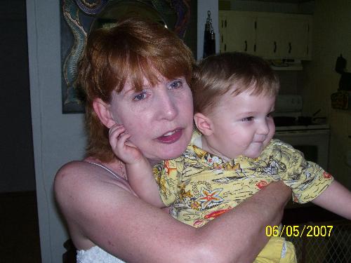 A picture of my mom on myspace - This one of the pictures of my mom on myspace. She is good looking for her age but some of the men sending her these messages are really young. Can't see why they would want a serious relationship with her and move across the us to be with her.   In the picture my mom is holding my son Ashden. Maybe they have very tiny monitors and think she's his mom.LOL