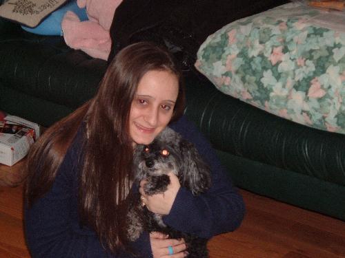 Me and the Dog - This is a picture of me and my husband's dog. We had to eave her at my in laws house when we moved out, cause they don't allow pets where we live now.