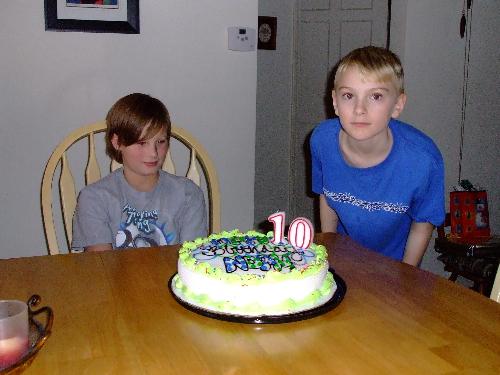 my boys with birthday cake  - The boys on a birthday, getting ready to eat some cake!