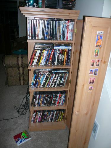 Movie collection - Here is a picture I took of my movie collection in my entertainment center. I have some more that my friends are borrowing. Some of the movies I can watch over and over again and some I watch once in a while or just once.
