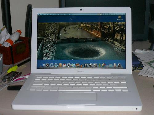 Macbook - This is a picture of my Macbook that I got back in November. It is a wonderful laptop and you can do so much with it and it is much more secure than Pcs. It is definitely worth the price and if you love pictures and music, it has excellent graphics programs and Itunes with it.