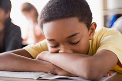 Classroom sleeping - A student sleeps in classroom